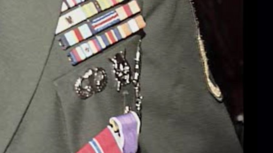 Photo: Bird wore the Special Operations Combat Diver Badge on the left side of his uniform coat.